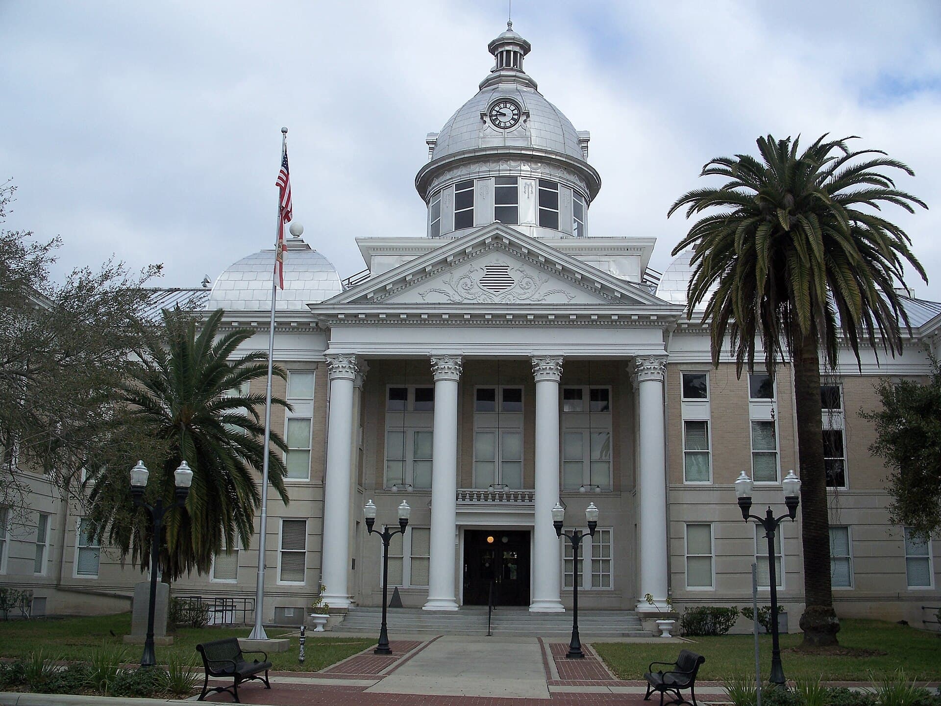 Historic Polk County courthouse in downtown Bartow surrounded by oak trees